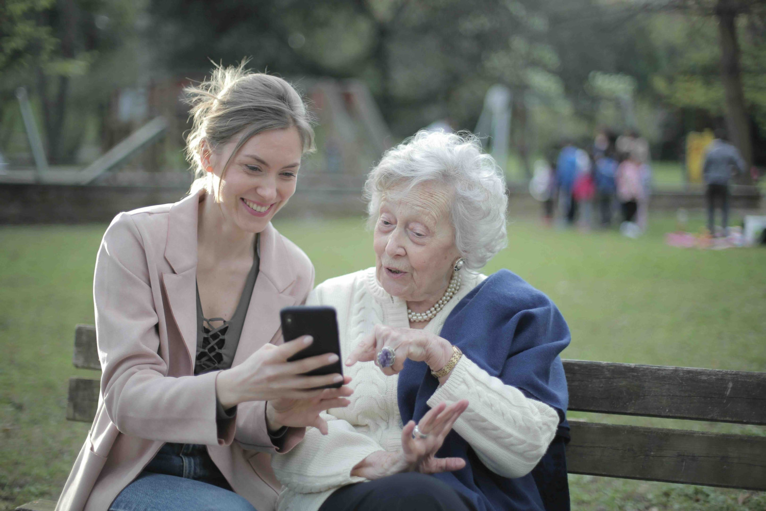 Boca Raton accountant two women looking at phone