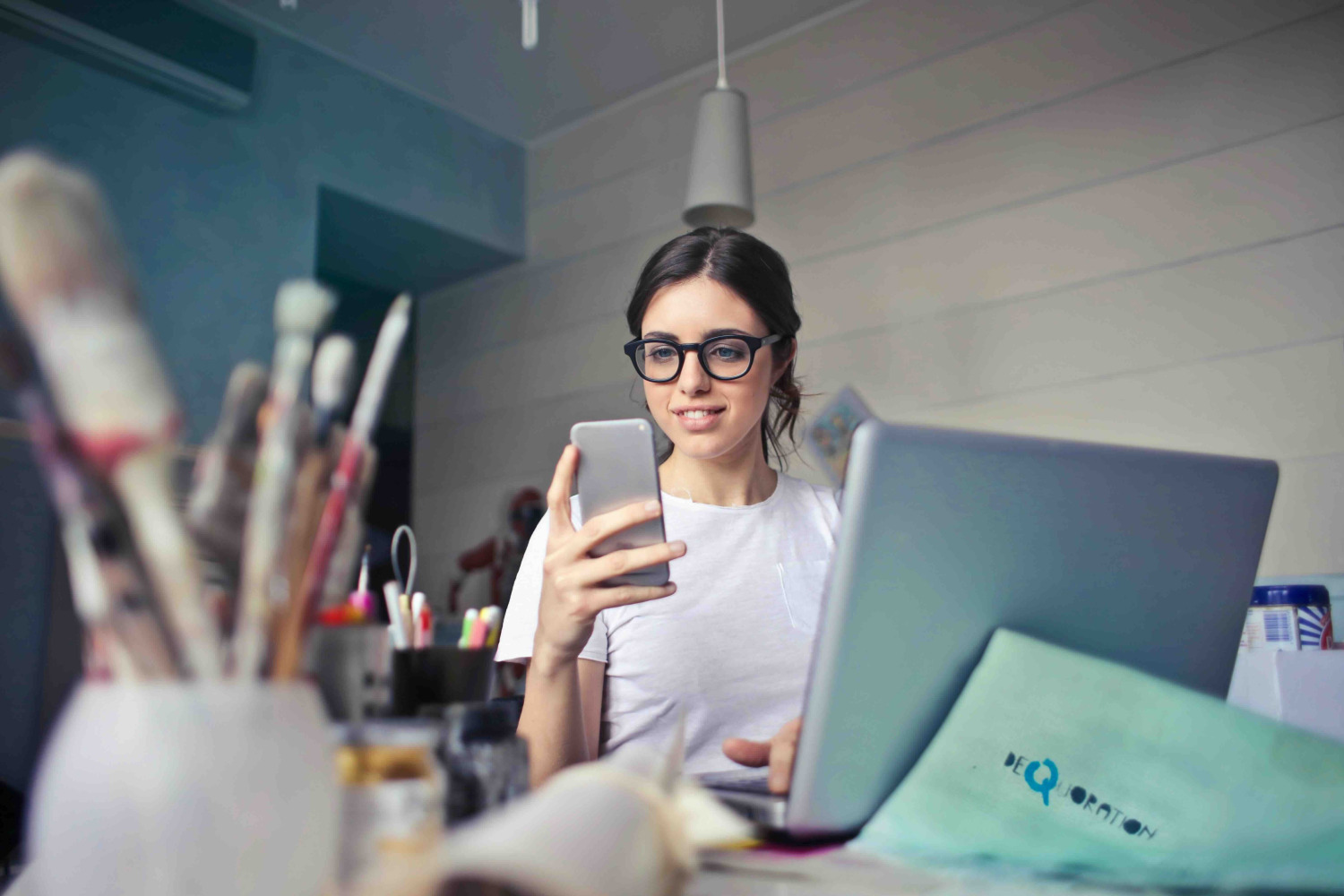 Boca Raton accountant woman with phone and laptop